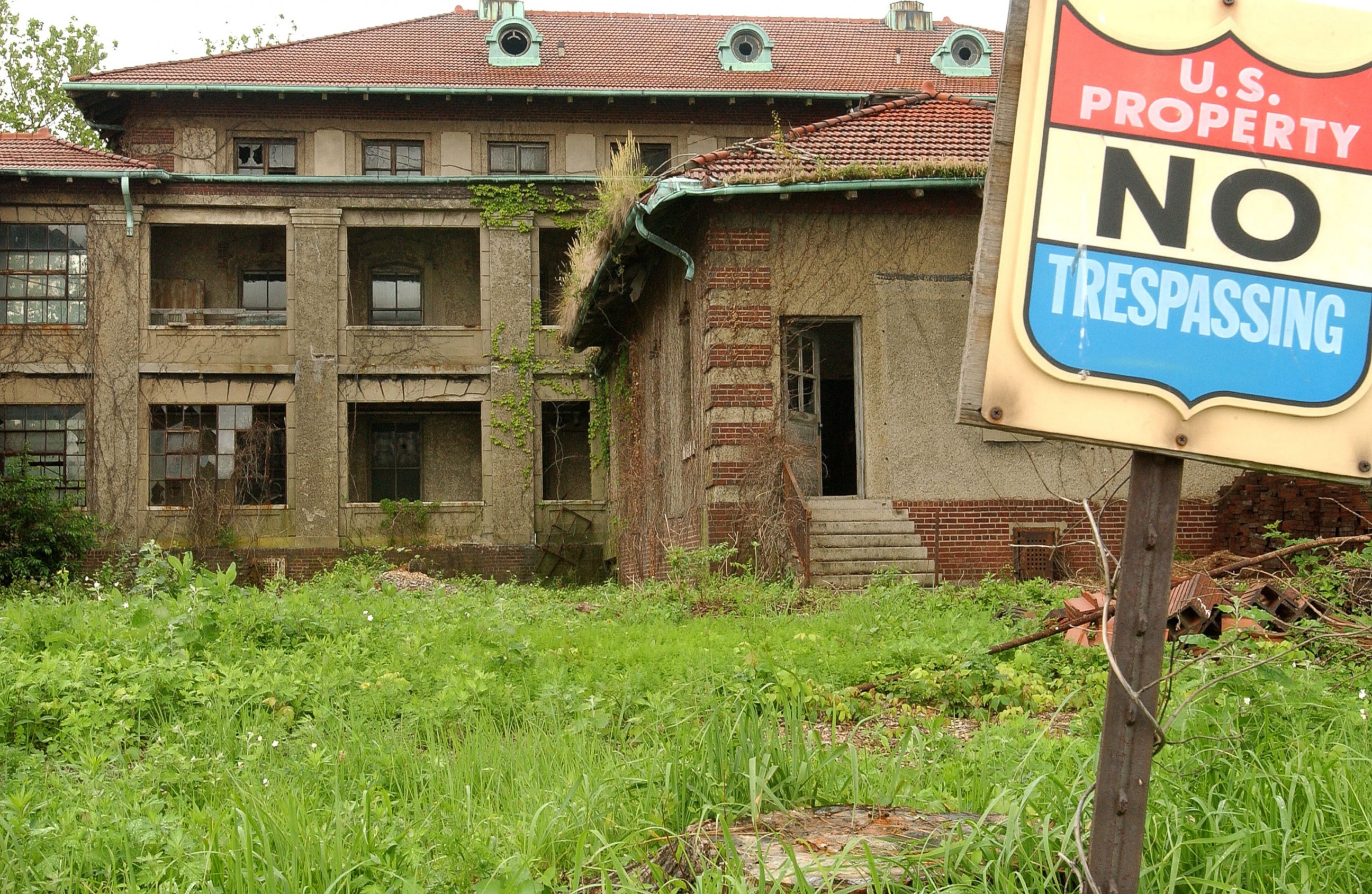 PHOTO: The dilapidated exterior of one of the Ellis Island hospital buildings is seen on June 3, 2003 in the hospital complex prior to restoration.