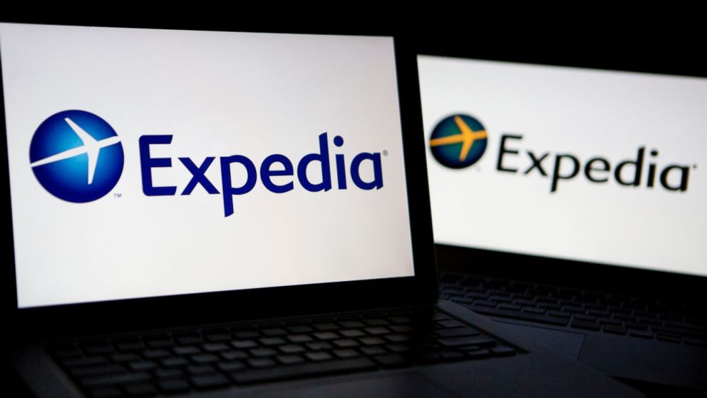 The Expedia Inc. logo is displayed on laptop computers arranged for a photograph in Washington, D.C., U.S., on Oct. 29, 2013. 