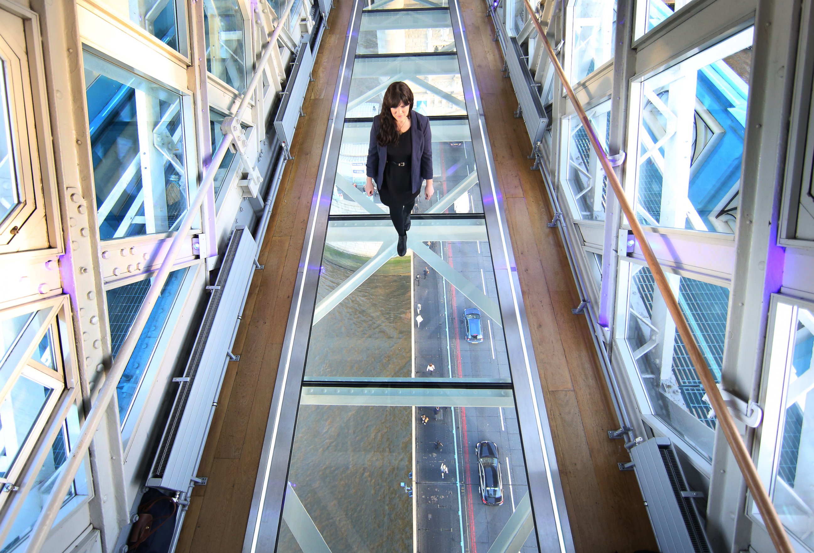 PHOTO: A visitor crosses Tower Bridge's new glass walkway on Nov. 10, 2014 in London, England.