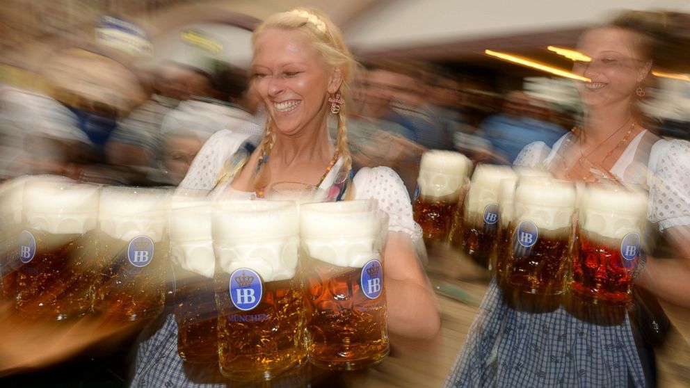 Waitresses serve beer during the opening of the Oktoberfest beer festival in Munich, Germany on Sept. 21, 2013.