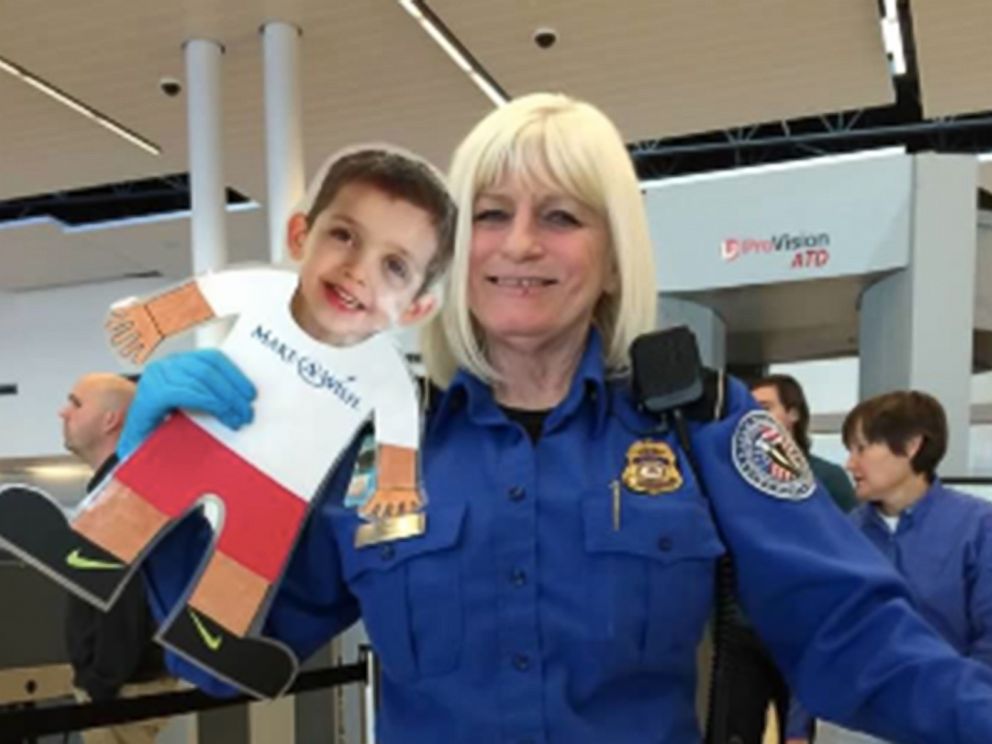 PHOTO: A TSA technician poses with "flat Levi" at a security checkpoint.