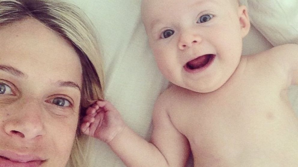 Molly Guy appears with her 3-month-old baby in a personal photo.