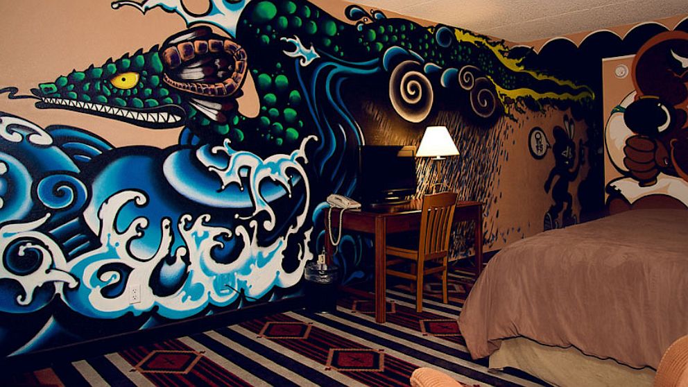 Would your sleep be sweeter if you bedded down in this one-of-a-kind art room guarded by a Yakuza-style mural of Avanyu, the Tewa tribe's deity of water? Or is original pop art by Warhol more to your taste? Or maybe, Victorian run amuk? Whether you're an art connoisseur or not, these over-the-top art rooms will add color and excitement to your dreams.