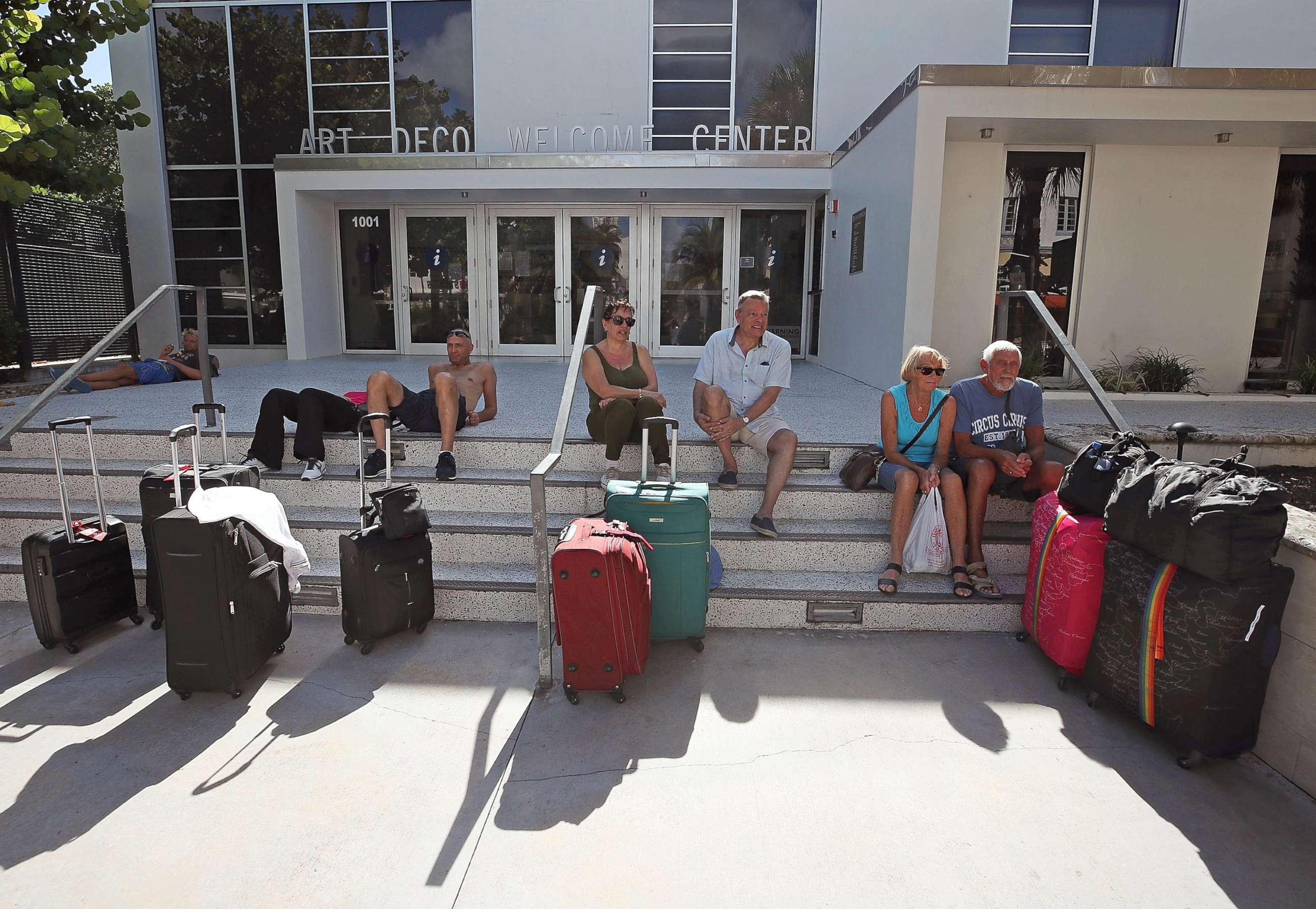 PHOTO: Tourists wait to catch a shuttle to a shelter as the city announced a mandatory evacuation ahead of the approaching Hurricane Irma, Sept. 7, 2017 in Miami Beach, Florida.
