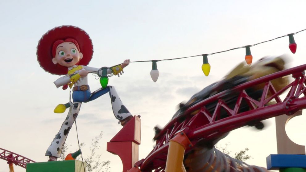 PHOTO: Slinky Dog Dash dashes is seen by a giant Jesse doll.