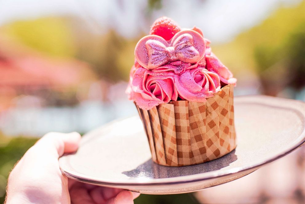 PHOTO: This chocolate devil’s food cupcake is filled with raspberry mousse and topped with millennial pink buttercream, fondant ears, and edible glitter.