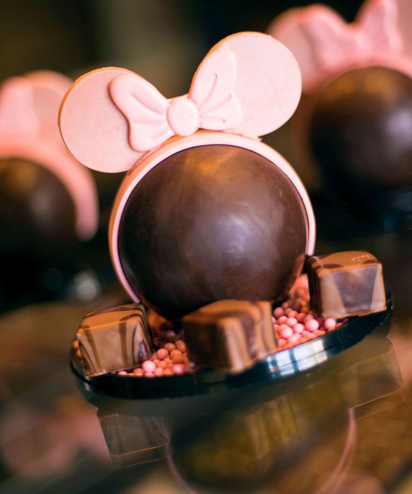 PHOTO: A dark chocolate dome filled with vanilla bean marshmallows and strawberry crispy pearls and topped with edible white chocolate ears.