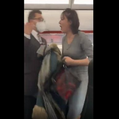 Passenger video shows a woman shouting and coughing on others as she’s escorted off a plane.