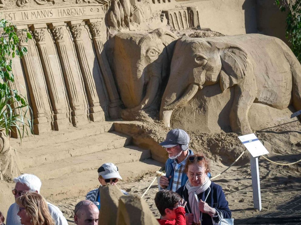 PHOTO: People visit sand sculptures depicting Christmas nativity scenes on the international beach resort of Las Canteras in Las Palmas de Gran Canaria on the Spanish Canary island of Gran Canaria on Dec. 7, 2017. 
