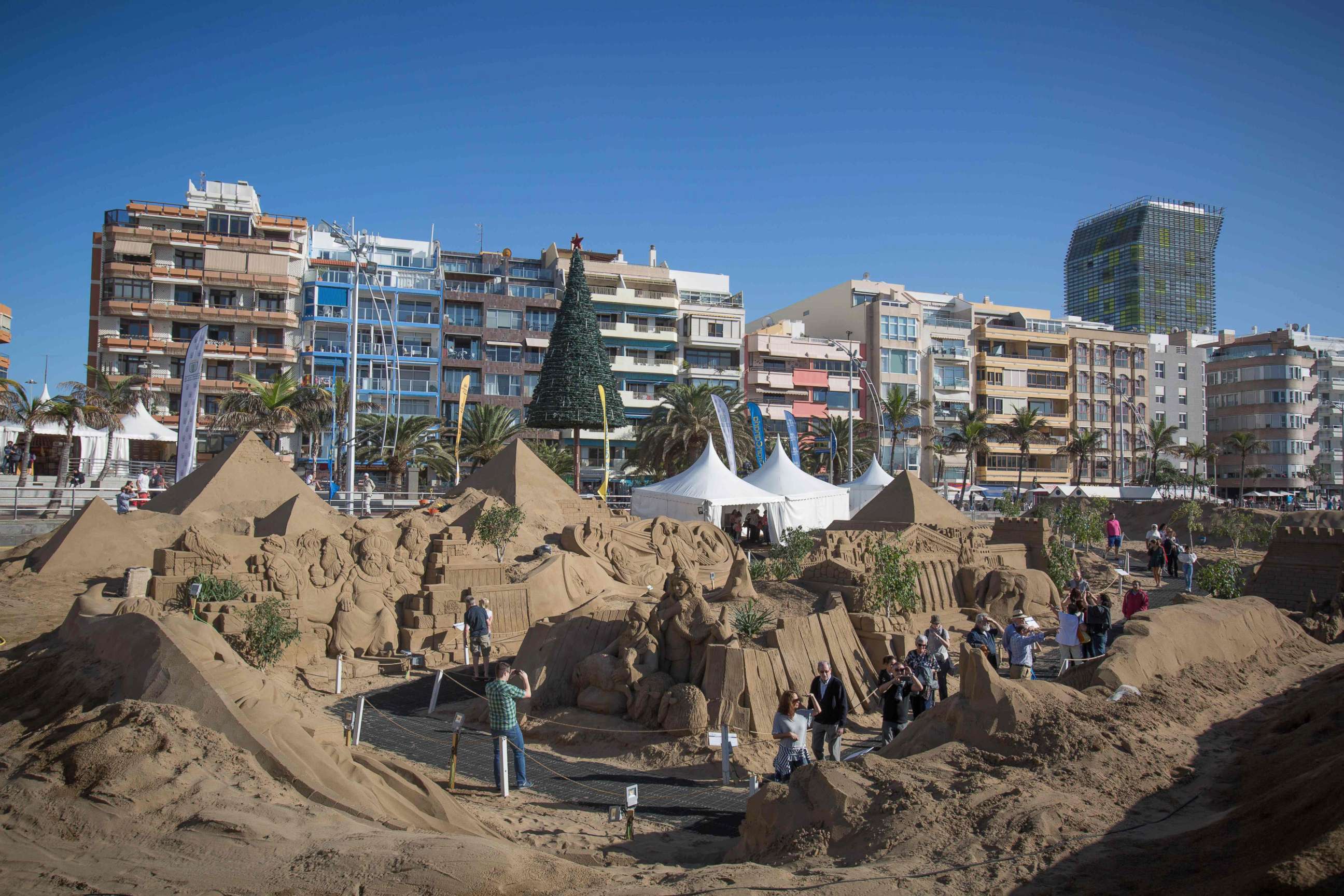 PHOTO: People visit sand sculptures depicting Christmas nativity scenes on the international beach resort of Las Canteras in Las Palmas de Gran Canaria on the Spanish Canary island of Gran Canaria on Dec. 7, 2017. 
