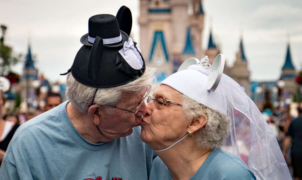 PHOTO: The Crisps share a kiss while vacationing in Disney World in 2016 with other nursing home residents from Riverview Health Care Center in Prestonsburg, Ky.
