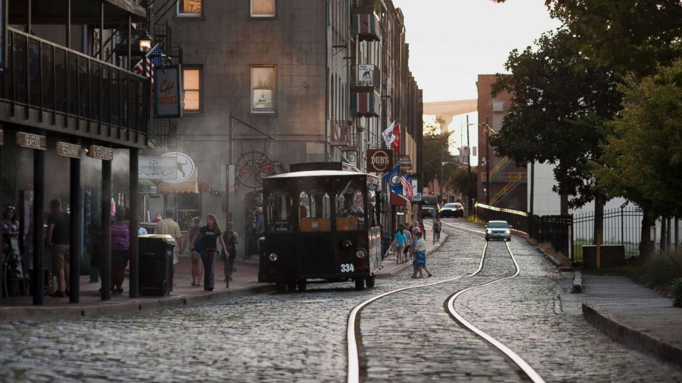 A trolley stops to pick up passengers on River Street in Savannah, Ga., Aug. 15, 2015.