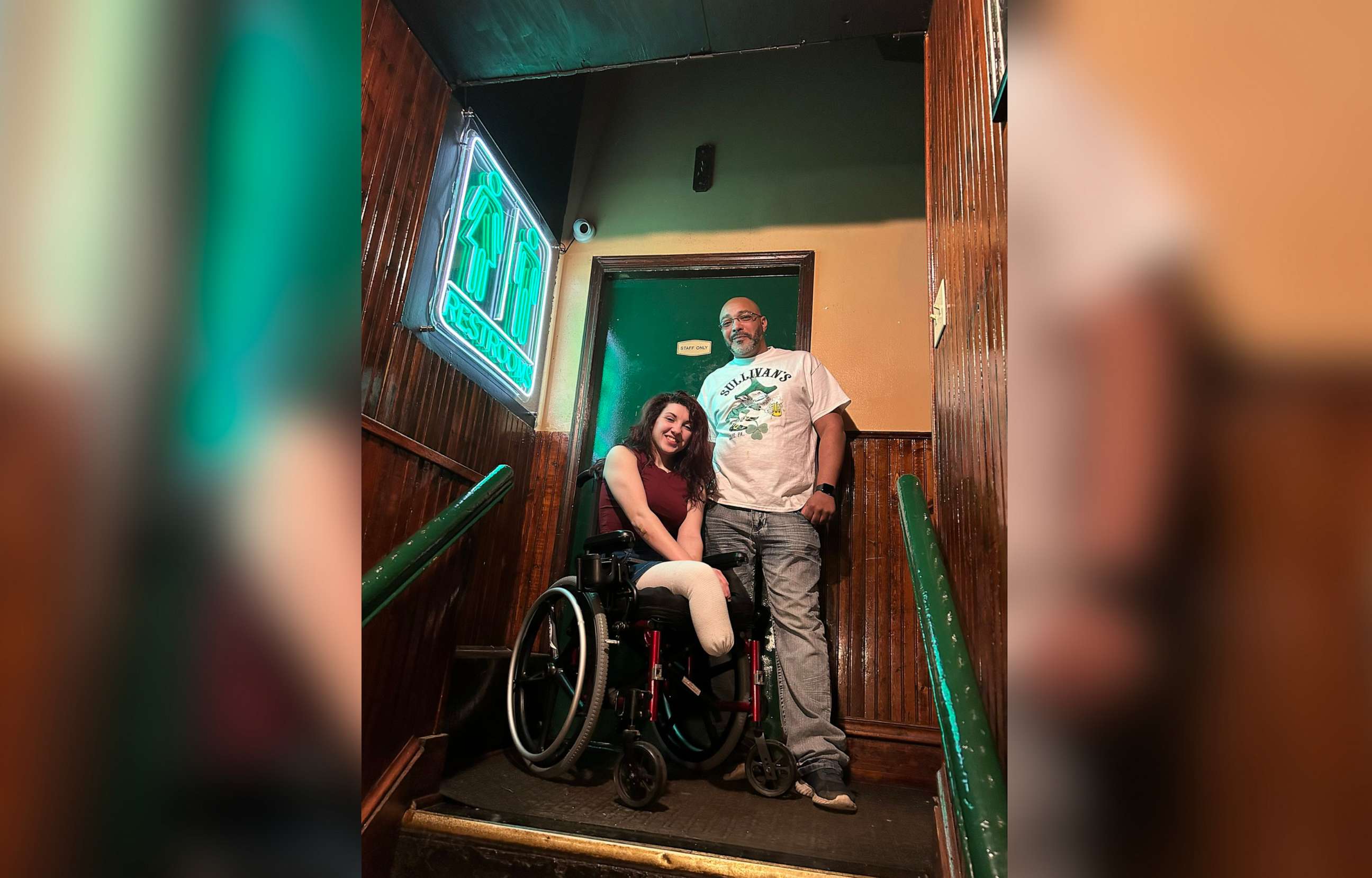 PHOTO: Sydney Benes with head of security Nate Sanders at Sullivan's Pub. Sanders said Benes is looking to press charges against the two men who pushed her chair down the stairs and damaged it.