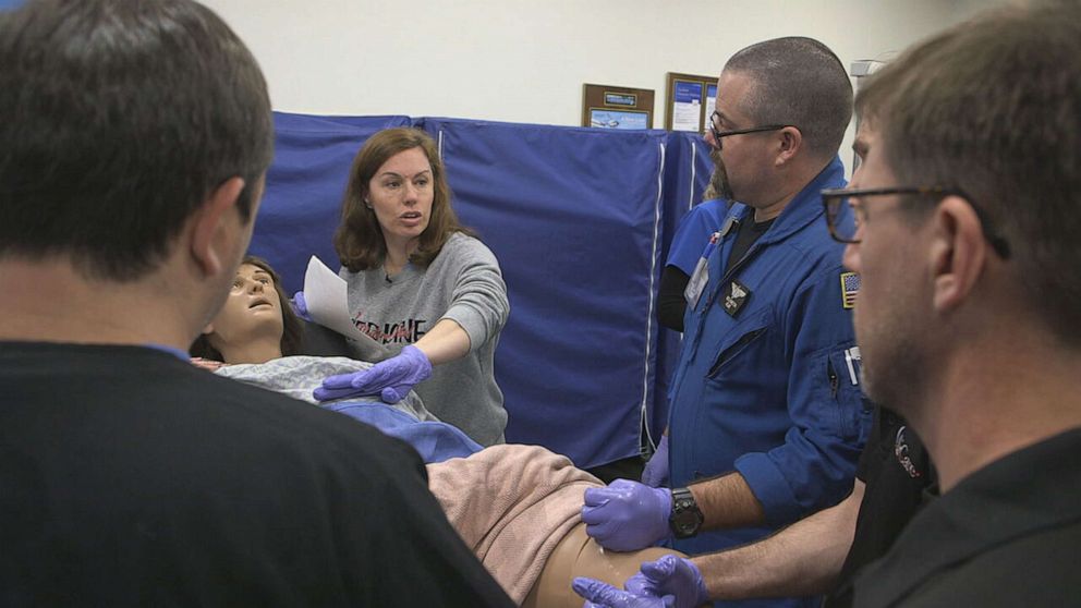 PHOTO: Maternal fetal medicine specialist Rachael Morris performs a demonstration during a training with first responders in Mississippi.