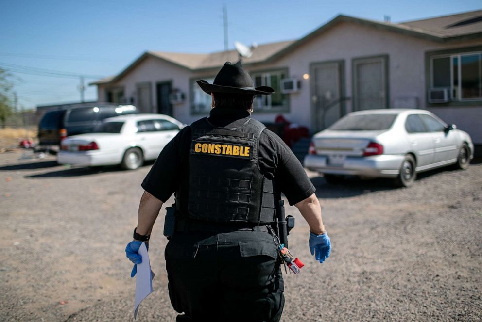 PHOTO: Maricopa County constable Darlene Martinez arrives to a home to post an eviction order on Oct. 1, 2020 in Phoenix.