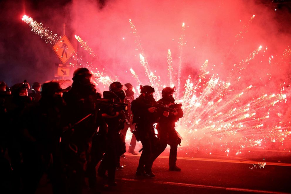 PHOTO: Police advance on protesters to clear a street on the 100th consecutive night of protests against police violence and racial inequality, in Portland, Oregon, on Sept. 5, 2020.