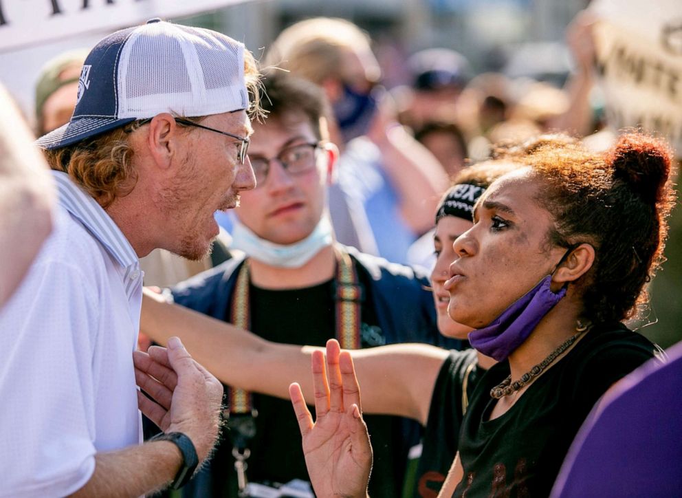 PHOTO: Jessica Moore, of Ullin, Ill., attempts a dialogue with a counter-protester while rallying against the death in Minneapolis police custody of George Floyd, in Anna, Ill., June 4, 2020.