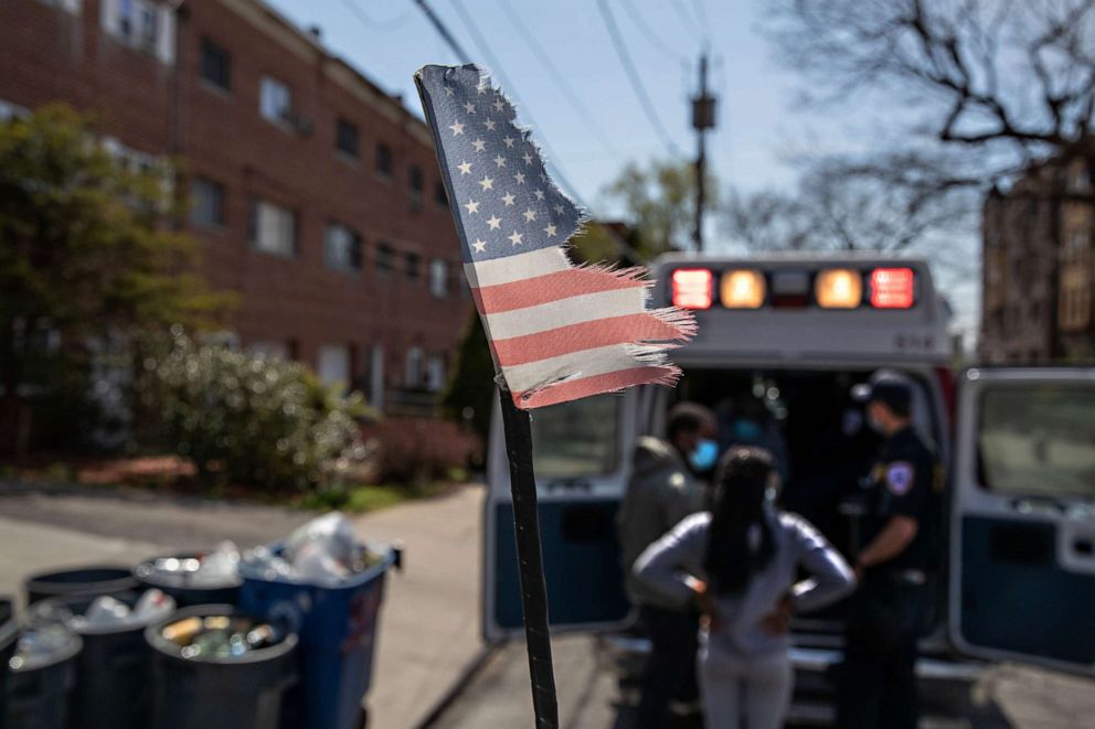 PHOTO: Empress EMS paramedics transport a suspected COVID-19 patient from a home, on April 7, 2020, in Mount Vernon, New York.