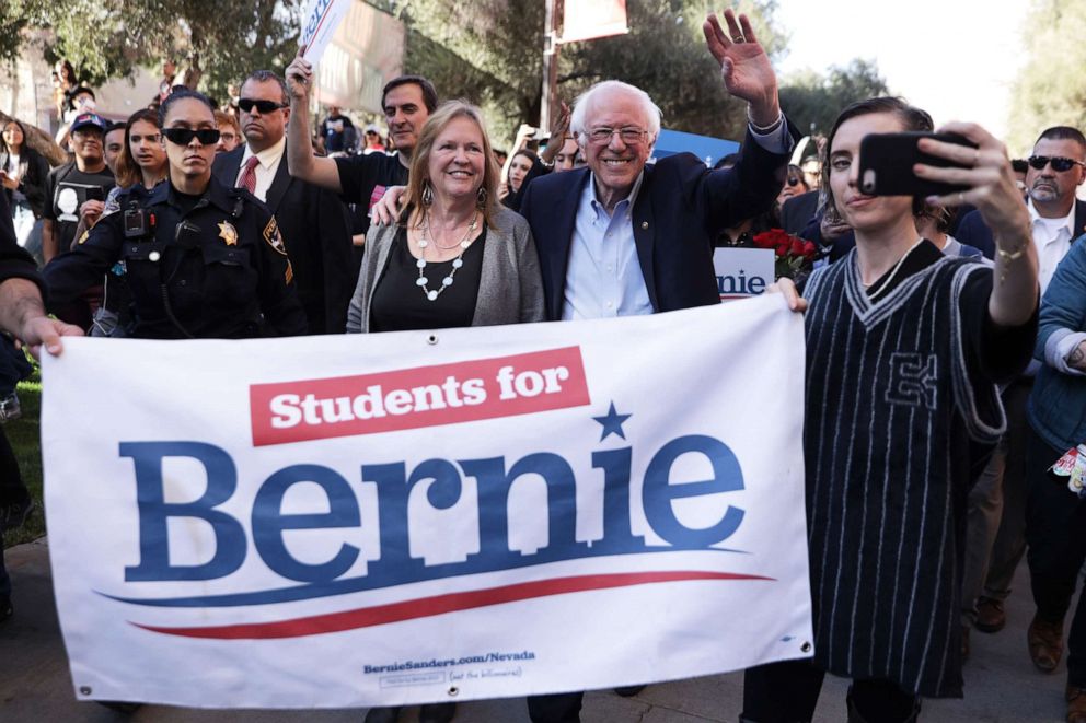 PHOTO: LAS VEGAS, NEVADA - FEBRUARY 18: Democratic presidential candidate Sen. Bernie Sanders (I-VT) and his wife Jane Sanders participate in a march after a campaign rally at University of Nevada February 18, 2020 in Las Vegas, Nevada. 