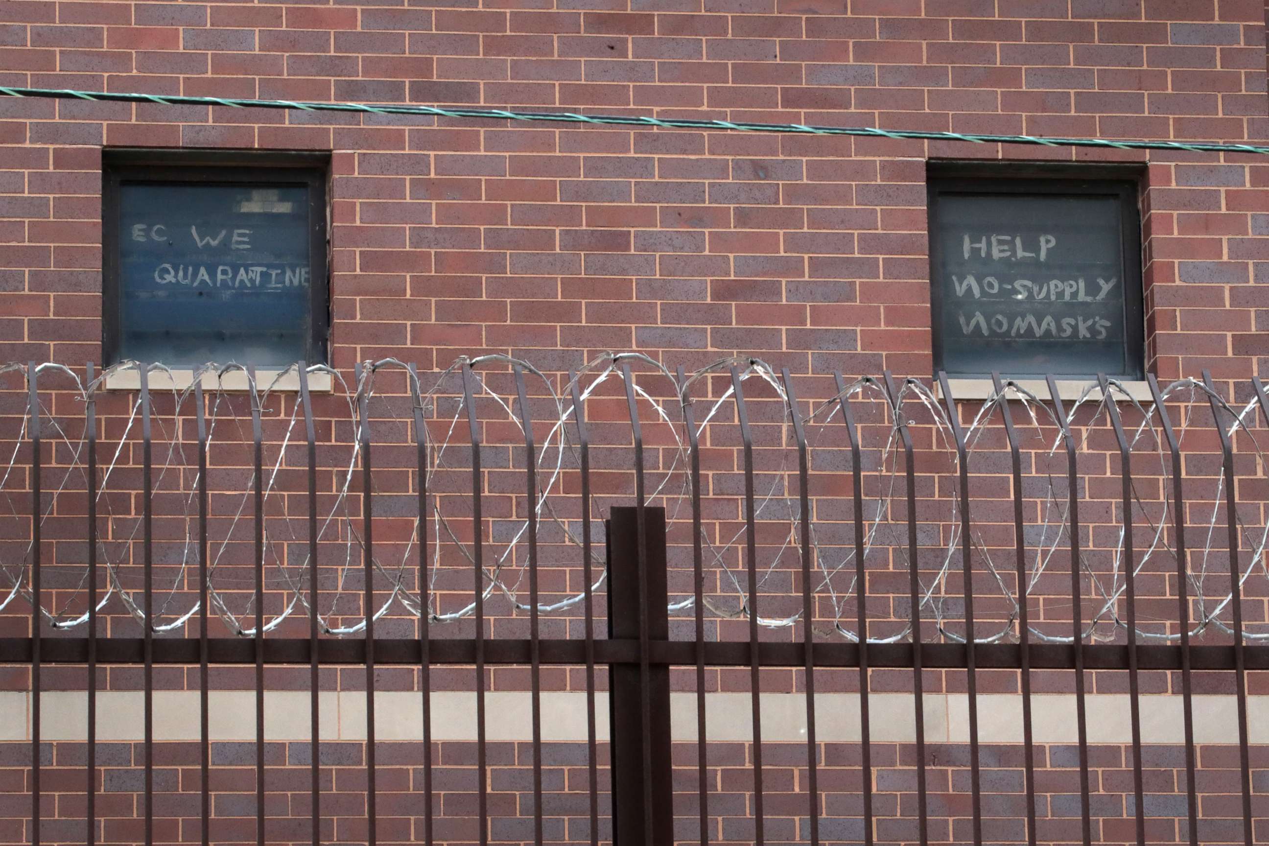 PHOTO: Signs pleading for help hang in windows at the Cook County jail complex on April 9, 2020 in Chicago.