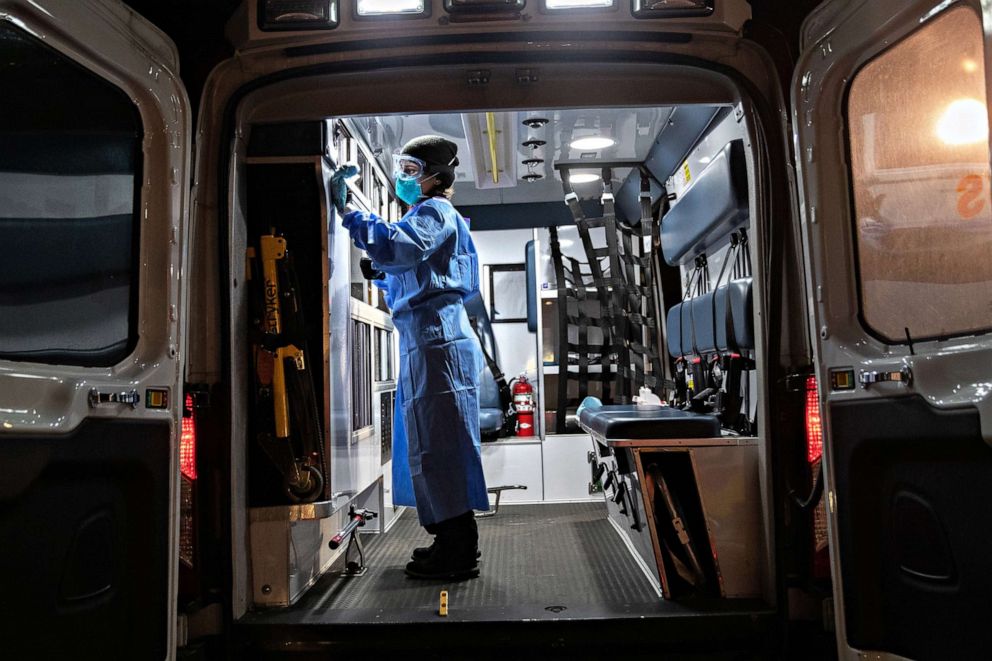 PHOTO: An Empress EMS employee decontaminates an ambulance, on April 06, 2020, in Yonkers, New York.