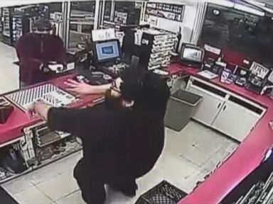 VIDEO: Robber threatened to set clerk ablaze at Palm Bay, Florida, convenience store.