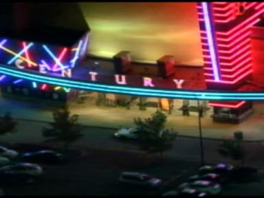 VIDEO: A frightened caller inside the Colorado theater reported the sound of fireworks shortly after the shooting.