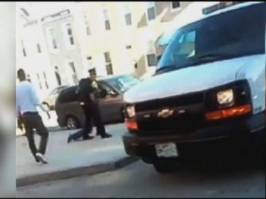 VIDEO: Cell phone video shows Freddie Gray screaming as officers drag him to a police van.