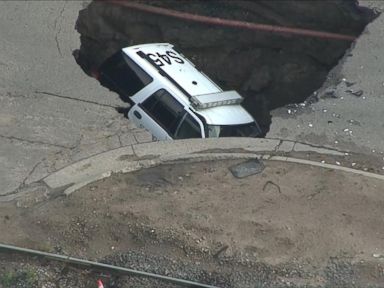 VIDEO: Massive Sinkhole Swallows Police Car