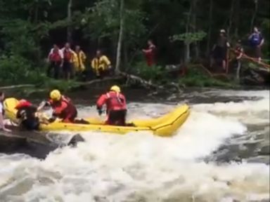 VIDEO: Rescuers in Maine used a line attached to a drone to deliver life jackets to people stranded on a rock.