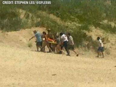 VIDEO: The 68-year-old man was airlifted to the hospital after being bitten in lower the leg, hip and hands off the coast of Okracoke Island, North Carolina.