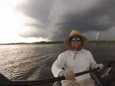 VIDEO: The kayaker was caught up in stormy weather while paddling in coastal waters near Aripeka, Florida.