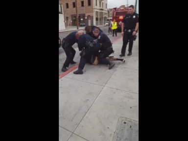 VIDEO: Emilio Mayfield, 16, was tackled to the ground by several Stockton Police officers for allegedly walking in a bus lane on his way to school.