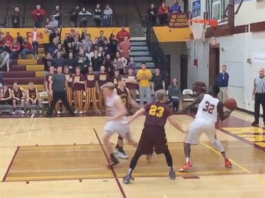 VIDEO: Basketball player Oman Oman for Austin High School in Austin, Minn., scored a shot made from the other side of the court just before end-of-game buzzer rang.