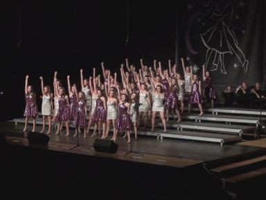 VIDEO: The girls show choir from the Wheaton Warrenville South High School in Illinois won their competition last weekend after watching all of their costumes, instruments and personal belongings burn in a bus fire the night before.