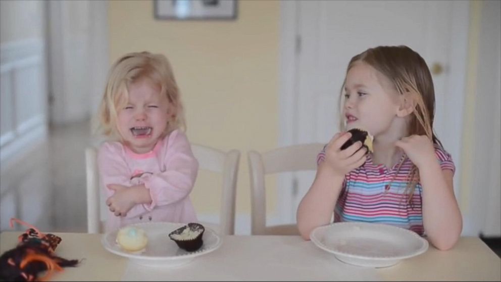 little girls playing with babies