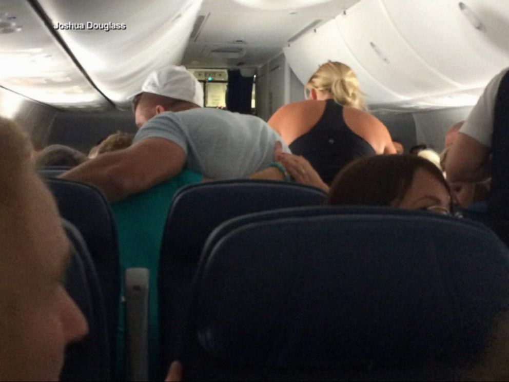 Tim Tebow rushes to help during in-flight medical emergency