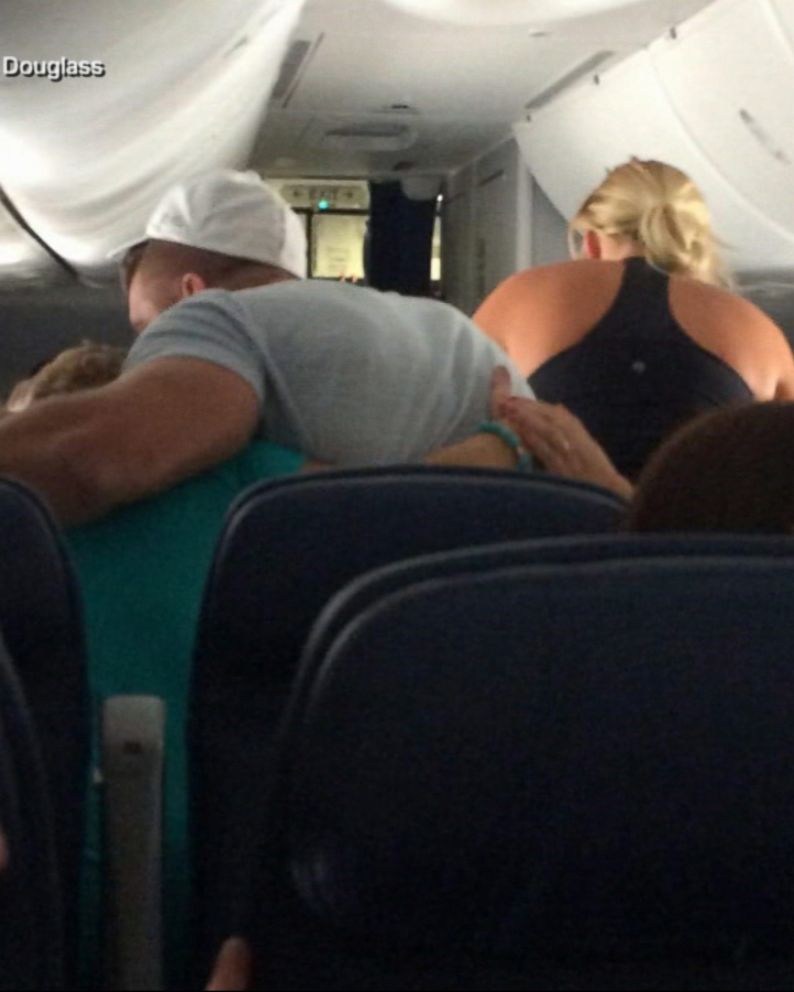 Tim Tebow rushes to help during in-flight medical emergency