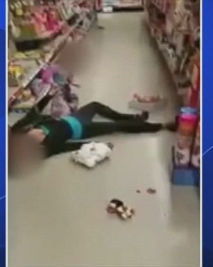 Massachusetts police released a video showing a toddler trying to rouse her apparently unconscious mother from an alleged drug overdose. 