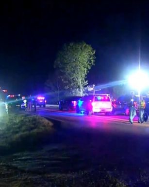 Authorities in Oklahoma have launched a manhunt for a suspect in a double homicide who also allegedly opened fire on two police officers with an AK-47, striking both officers in the legs.