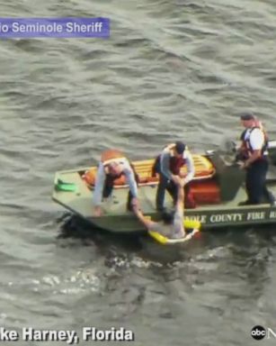 Dramatic rescue captured on video as deputies rescuing men from lake in Florida after their boat capsizes.