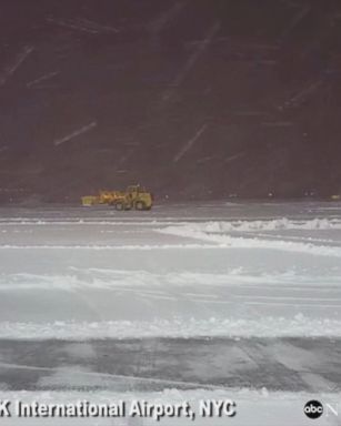 VIDEO: Snow plows clear runways at New York's JFK International Airport as a winter storm bears down on the area.