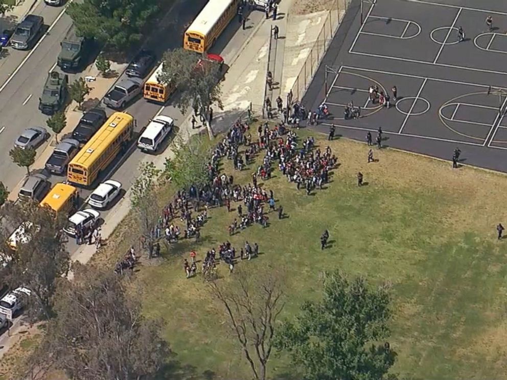 PHOTO: Helicopter footage shows students gathered outside North Park Elementary School in San Bernandino, California following a shooting, April 10.2017.