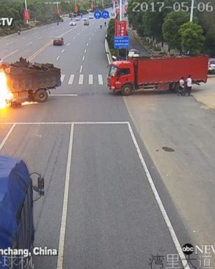 Dramatic video shows motorcyclist crashing into truck and bursting into flames; the motorcyclist sustained non-life-threatening injuries.