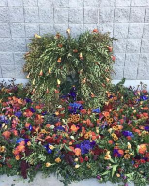 A group of florists attending a wedding convention in Las Vegas created a memorial at the Las Vegas Convention Center.