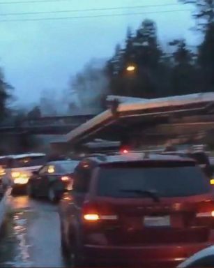 VIDEO: An Amtrak train derailed in Washington state this morning, leaving at least one of the cars dangling from an overpass over a highway, officials said.