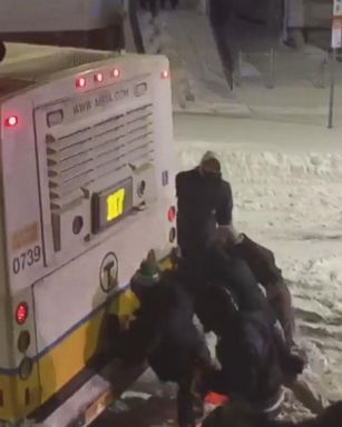 VIDEO: Residents in East Boston didn't allow a winter storm to trap an MBTA bus for long.