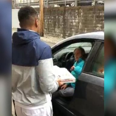 VIDEO: Mike Lewis II gave a woman who had been sleeping in her car chicken wings and pizza after a recent game.