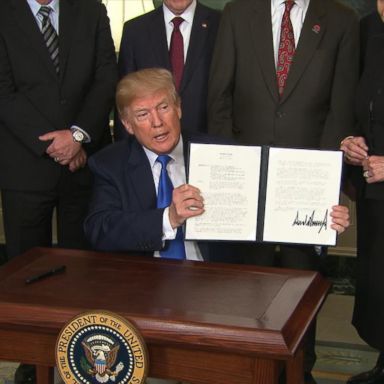 VIDEO: Trump signs action imposing tariffs on China