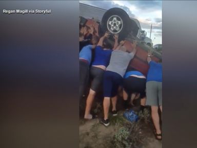 WATCH: Youth football team frees woman from flipped car